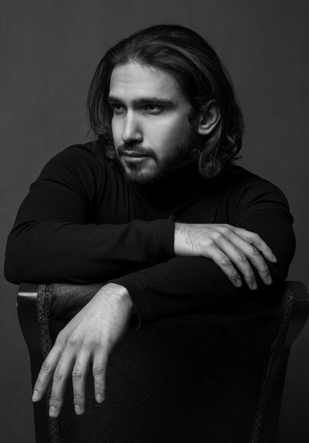 Black and white studio portrait of a distinguished middle-aged actor