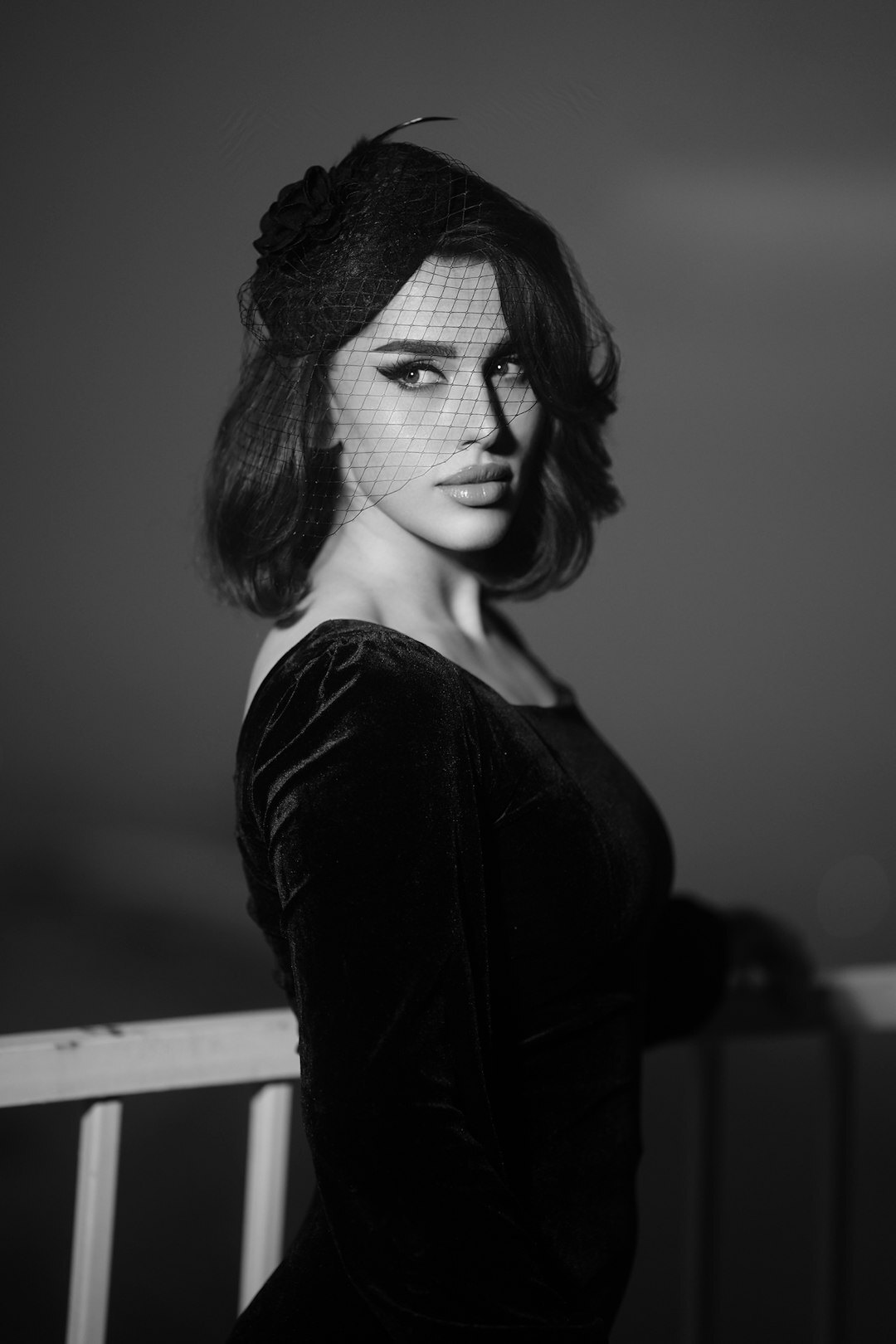 Editorial studio portrait of a sophisticated actress in couture dress